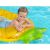 Close-up of boy on pineapple inflatable pool float