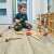 Boy Playing with Wooden Tool Set on Floor