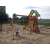 Woodlit Sunnydale wooden playground with slide, swings, and picnic table, green and brown
