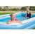 Family enjoying Bestway inflatable pool in backyard