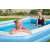 Family enjoying Bestway inflatable pool in backyard