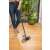 Woman using York Sabrina broom with handle and corner protection to sweep the floor