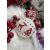 Springos white Christmas ornament with red reindeer and Christmas tree design in festive setting