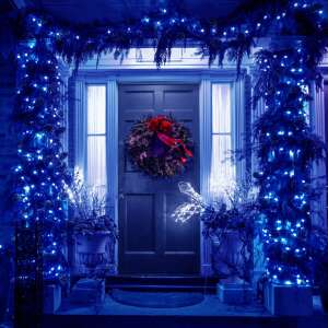 Festive home entrance decorated with Springos blue LED Christmas lights - Christmas