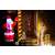 Springos inflatable Santa Claus Christmas decoration in use, outdoor setting