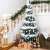 Springos Christmas tree decorated with white ornaments in a festive home setting