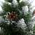 Close-up of Springos Diamond artificial Christmas tree branch with cones and snow