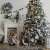Springos Snowy Caucasian Fir Christmas Tree 220cm decorated in festive setting