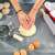 Woman using Springos silicone baking mat to knead dough in a kitchen