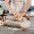 Woman kneading dough on a Springos silicone baking mat, with rolling pin and other ingredients