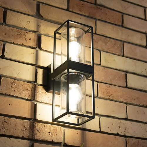 Lutec Flair czarna zewnętrzna lampa ścienna z dwoma gniazdami E27 oświetlająca ceglaną ścianę.