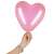 Woman's hand holding a Springos pink heart balloon
