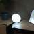 Philips Hue Go smart light bulb, white light, on a table