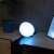 Philips Hue Go smart light bulb, white light, on a table