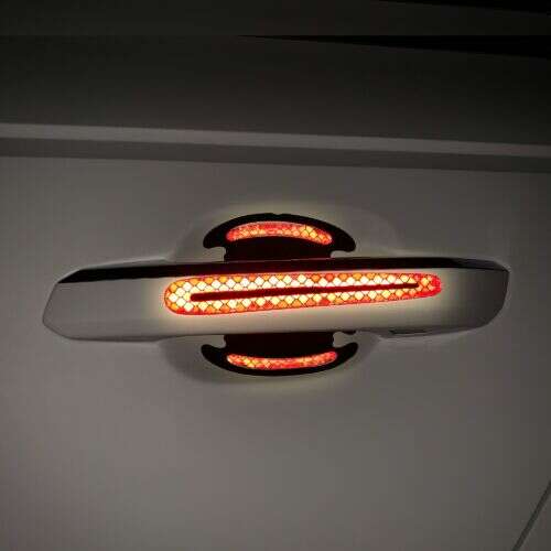 Kwmobile car door handle protector with reflective strip, black/red, ABS, 54690.02, installed on car door