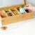 Navaris bamboo tea box with 10 compartments and glass lid, filled with tea bags