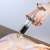 Ruhhy meat injector used to inject marinade into a chicken