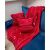 Ruhhy red blanket and pillowcase set with winter motifs on a blue sofa