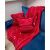 Ruhhy red blanket and pillowcase set with winter motifs on a blue sofa