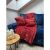Ruhhy red blanket and pillowcase set with winter motifs on a blue sofa