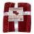 Red and white blanket with snowflake pattern and two matching pillowcases, packaged
