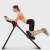 Woman using Timeless Tools abdominal muscle strengthening machine, black and red, 4 adjustable difficulty levels