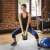 Woman using a 10kg Timeless Tools Kettlebell for a squat exercise
