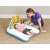 Bestway inflatable baby changing mat with rainbow arch and hanging toys, used by a mother on the floor
