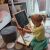 Child drawing on Kruzzel chalkboard easel in playroom
