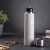 Berlinger Haus Aspen Collection 0.5L stainless steel vacuum flask, grey, on a table with accessories