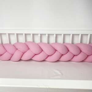 Pink waffle knit braided crib bumper in use, baby crib bumper, baby bed bumper, baby safety bumper, baby crib padding, baby bed padding, baby crib protection, baby bed protection, baby crib decor, baby bed decor - Bumper & Crib Liner