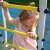 Child playing on Kometa Fitness outdoor playground