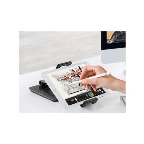 Adjustable tablet stand for desk, showing a person using a tablet with a stylus