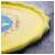 Close-up of the yellow 170cm diameter splash mat with blue and red fish design