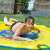One kid playing in the yellow 170cm diameter splash mat with blue and red fish design