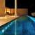 RGB LED pool lights illuminating a swimming pool at night