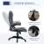 Side view of the ergonomic office chair with adjustable height, grey fabric, black base, comfortable backrest, armrests, and wheels, showing the reclining mechanism