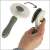 Self-cleaning pet brush for dogs and cats, showing the button that releases the hair