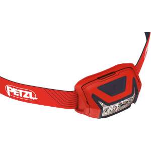 Lampa czołowa Petzl Actik w kolorze czerwonym, widok ukośny pokazujący lampę czołową i pasek na głowę - Latarka i czołówka