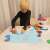 Child playing with Kruzzel Play Dough Mixer Set with Accessories, showing the play mat and other accessories