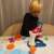 Child playing with Kruzzel Play Dough Mixer Set with Accessories