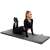 Woman exercising on Springos gray folding mat