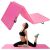 Woman stretching on Springos pink folding gymnastics mat