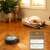 iRobot Roomba Combo j7 Robot Vacuum Cleaner cleaning hardwood floor in a living room
