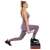 Woman doing lunges on Springos aerobic stepper side view