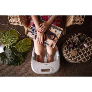 Woman using Camry CR2174 foldable foot spa with water heating, bubble and vibration massage, grey and white - Footbath