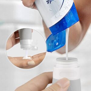 Filling a Quasar &Co. silicone travel bottle with lotion - Cosmetic bag