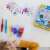 Spray pens and stencils for kids to create colorful art, featuring animal designs, with a child using the set