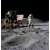 Astronaut planting the American flag on the moon
