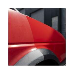 Red car with black tire and silver rim, before and after using Turtle Wax Black in a Flash Trim & Tyre Wax - Turtle Wax